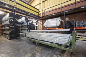 Staff Loading A Pallet Of Product In The Pelican Systems Warehouse